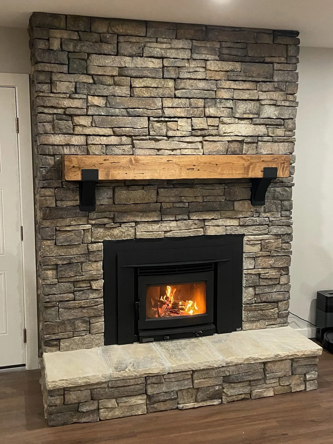 Brick fireplace with a wood insert