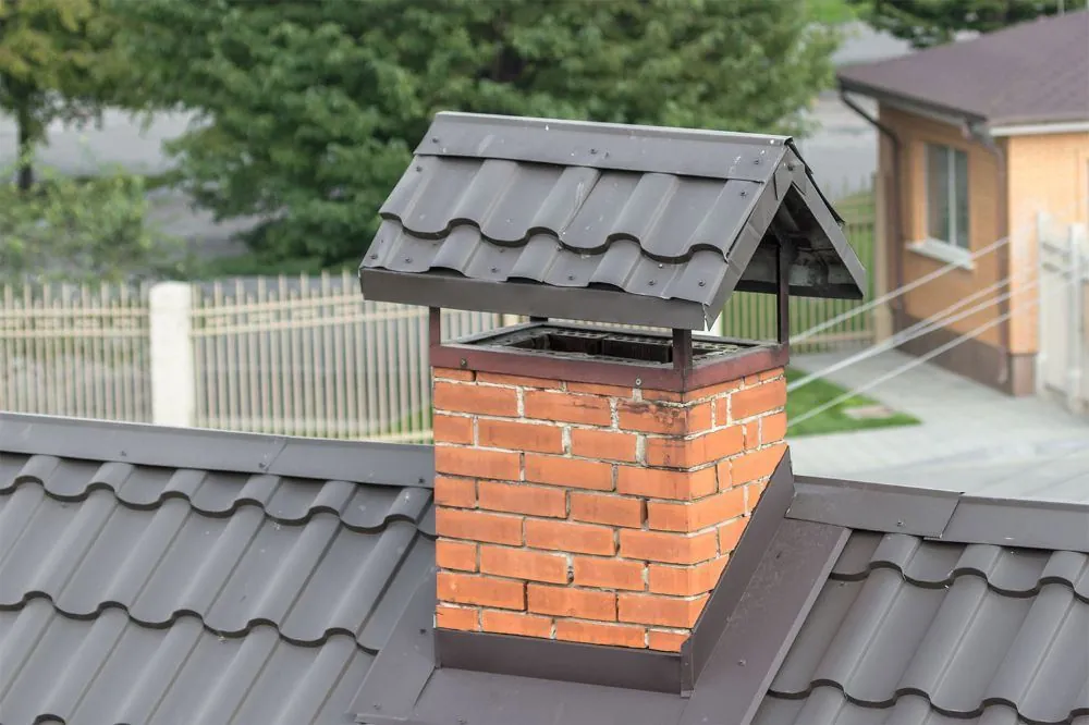 Brick chimney masonry on a residential roof