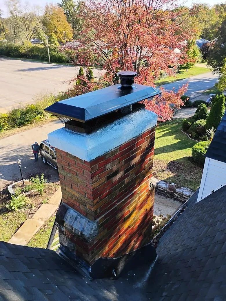 Chimney cap on a brick chimney in autumn