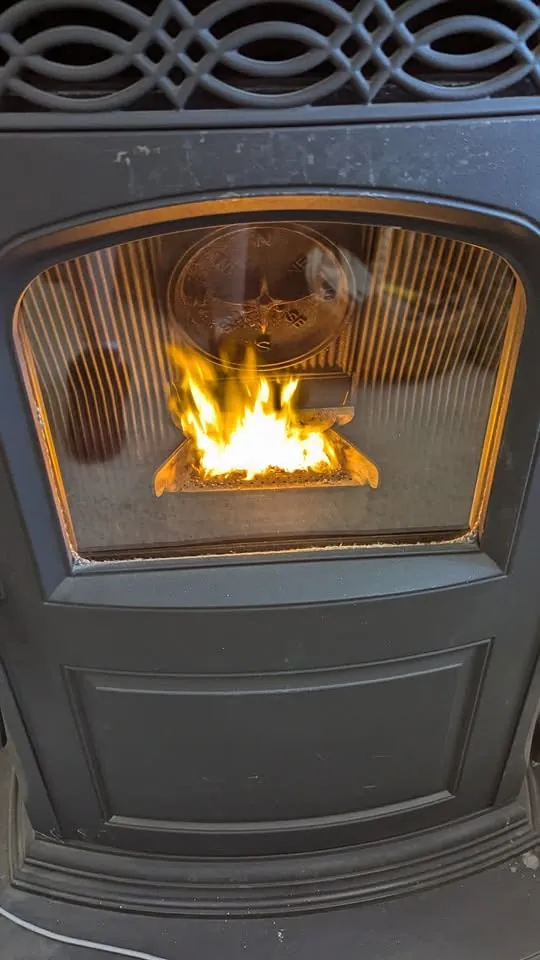 Flame inside a pellet-burning stove